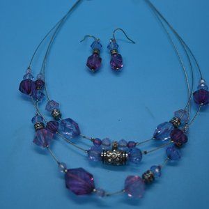Two sets of earrings and matching necklaces.